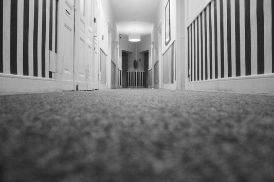 carpet and skirting board in hallway