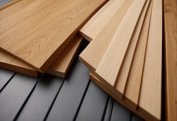 Three different types of skirting boards - MDF, pine, and solid oak - arranged side by side for comparison