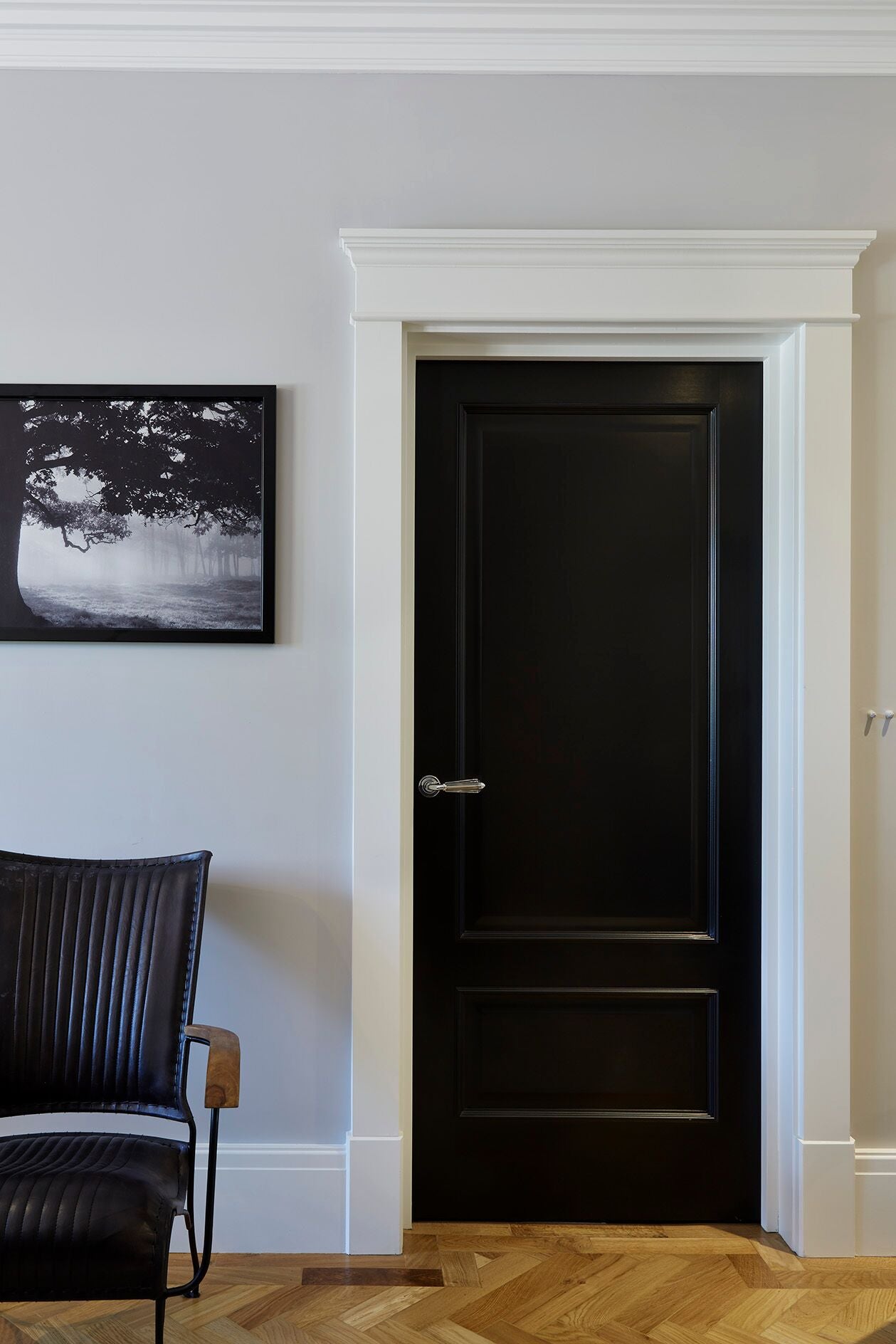 white MDF skirting board and architrave around a door